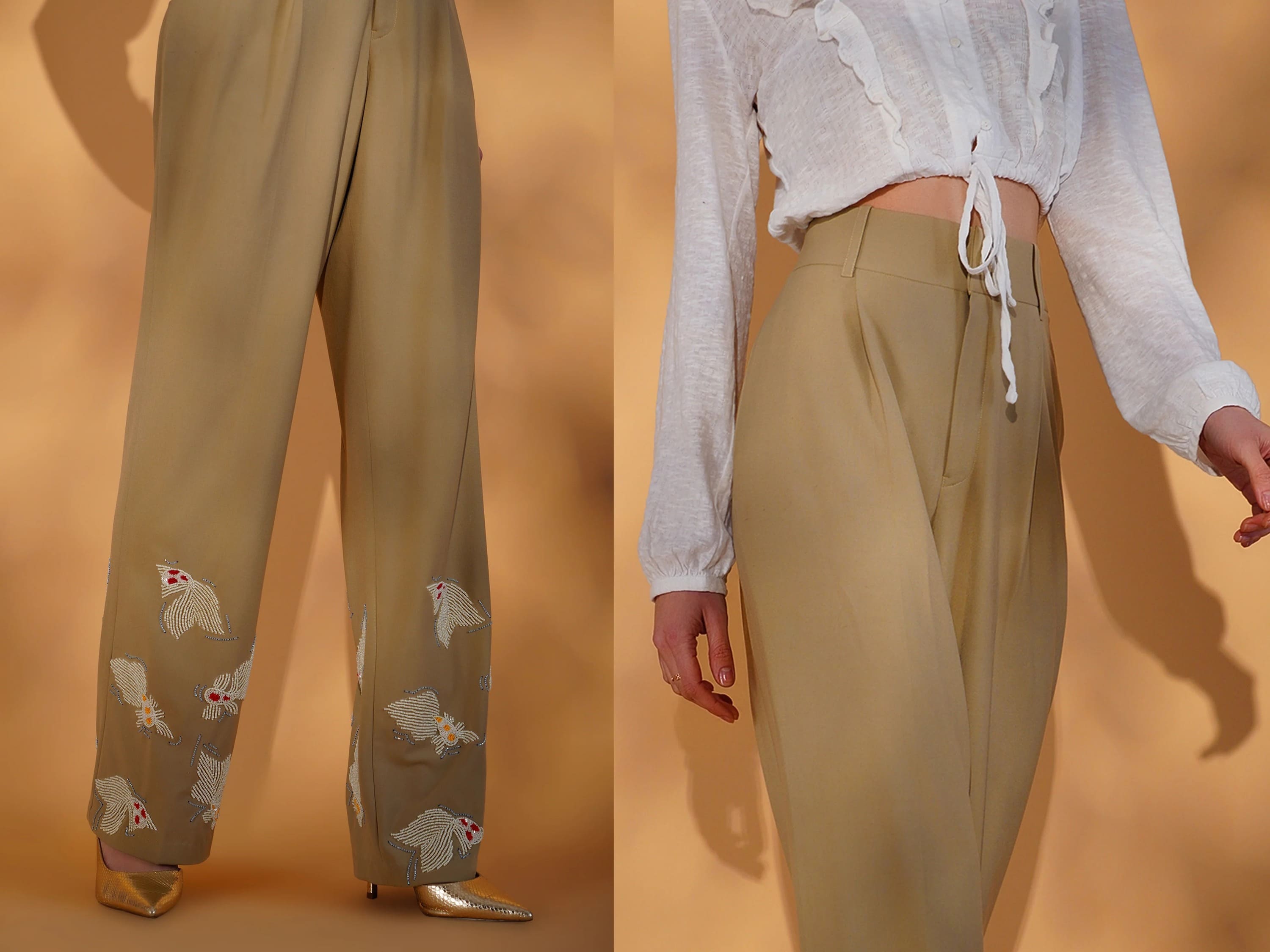 Beige pants with floral embroidery worn by a person on an orange background