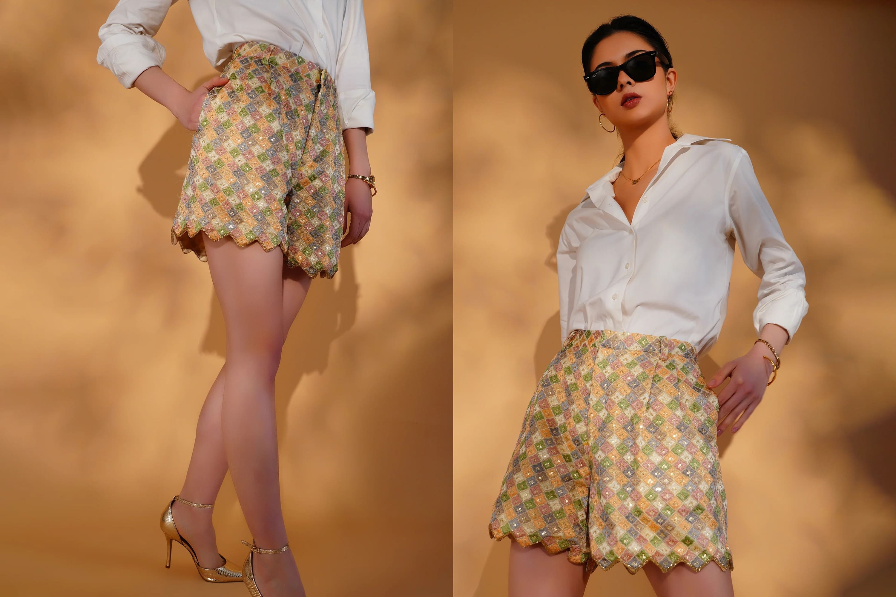 Woman wearing a white blouse and floral shorts against a warm-toned background