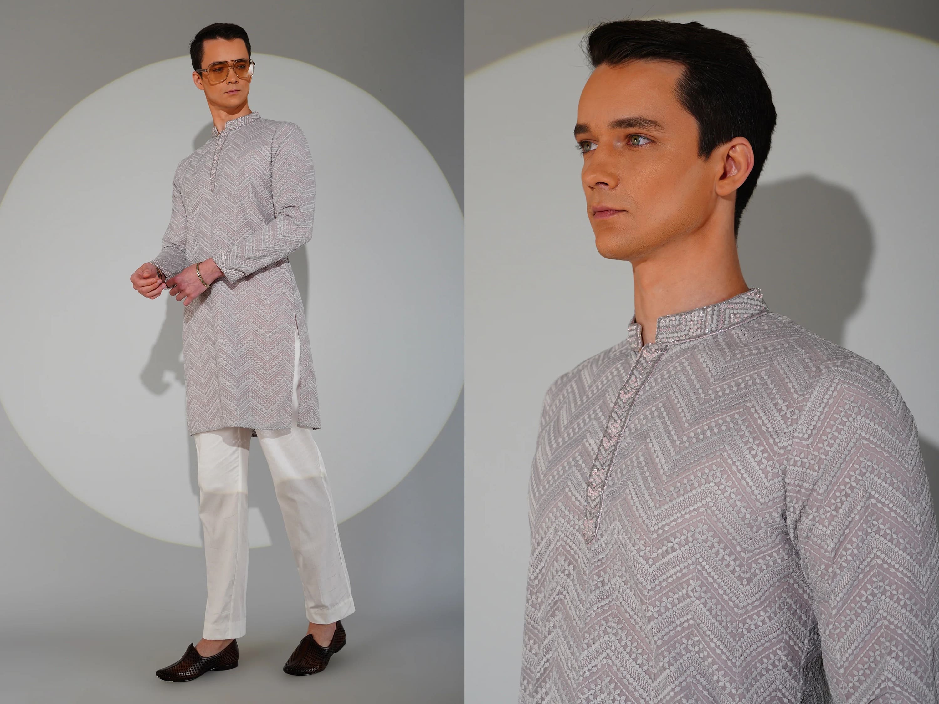 Man wearing a patterned kurta with white pants against a neutral background