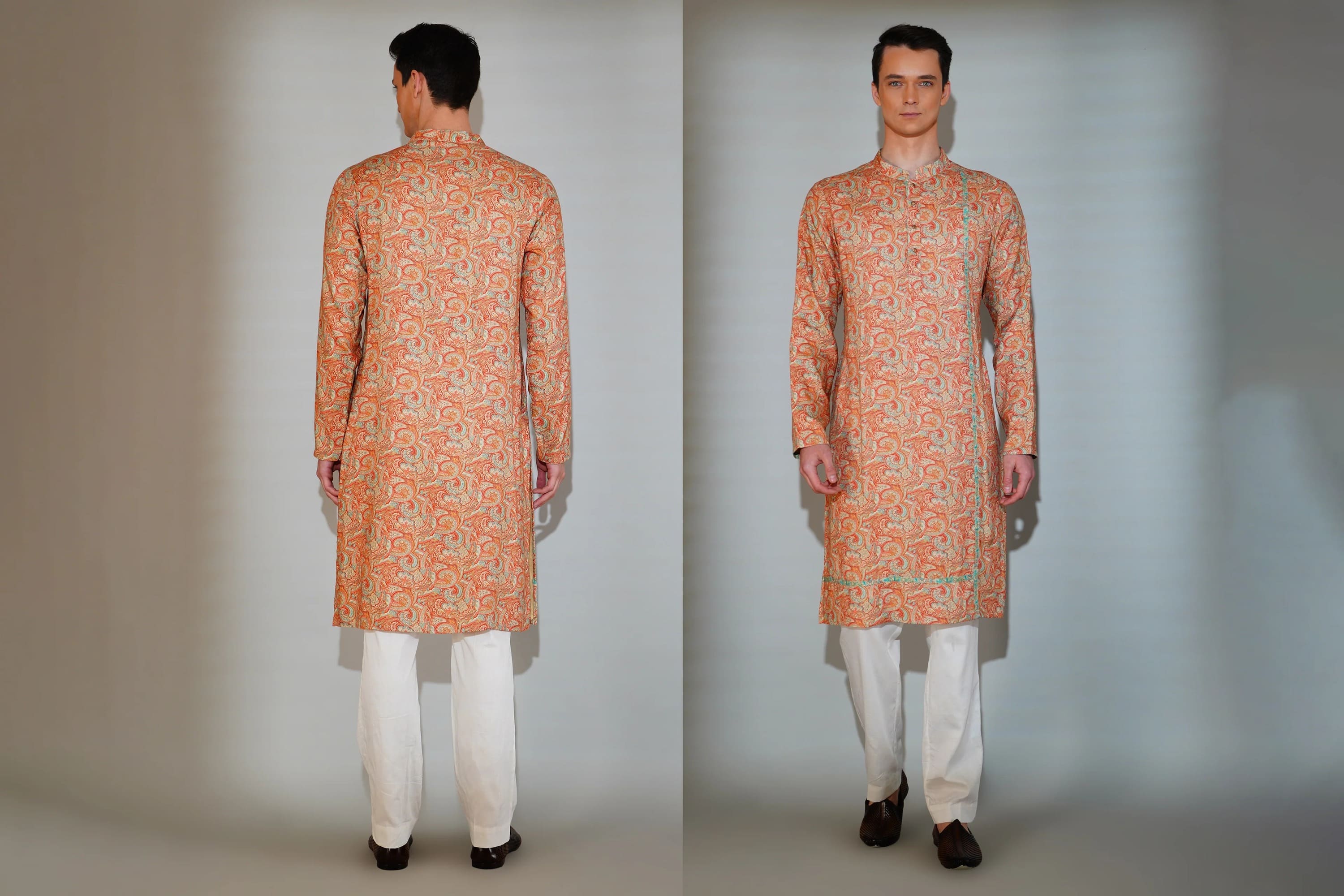 Orange kurta with white pants worn by a man on a plain background