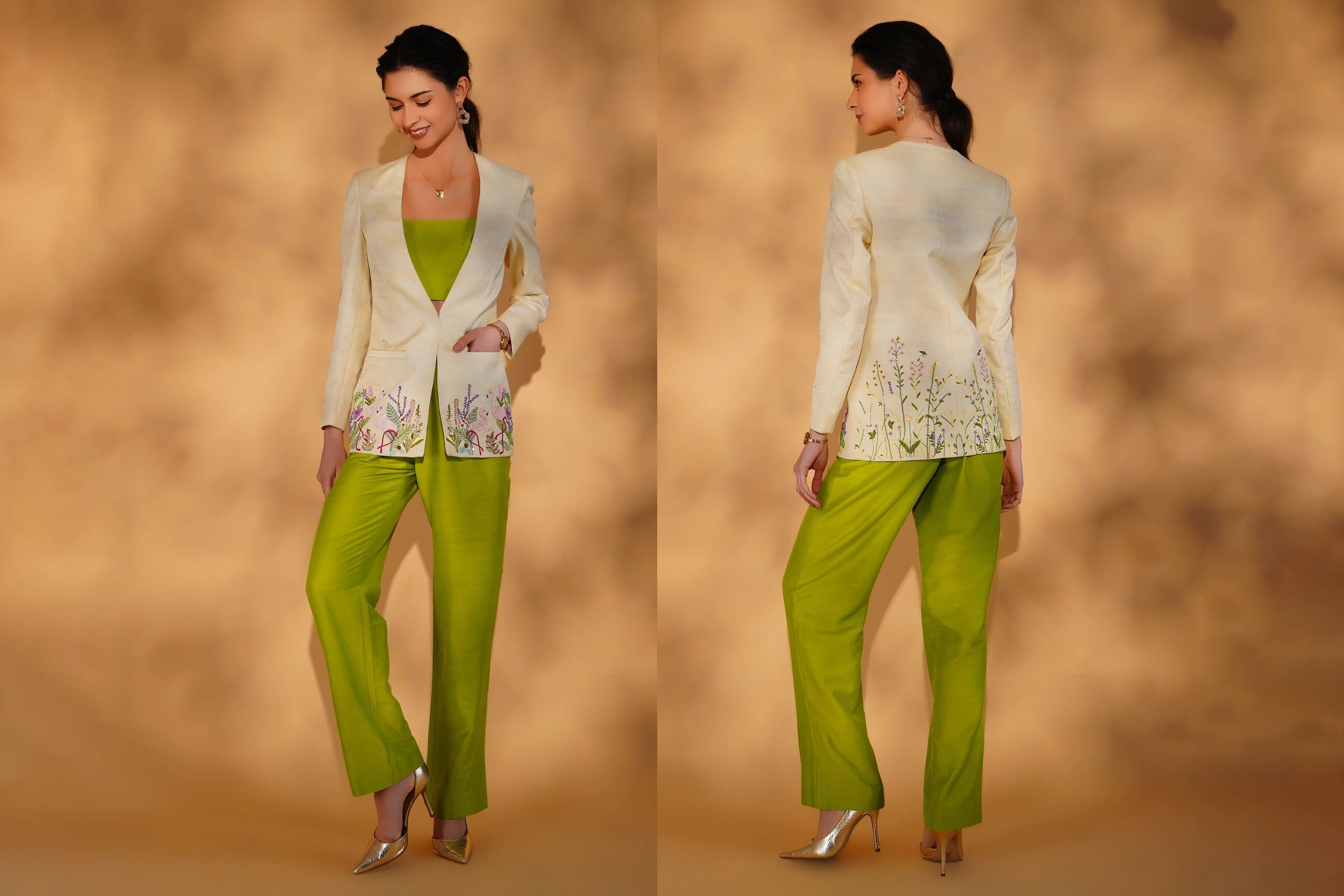 Woman wearing a white embroidered top and green pants against a beige background