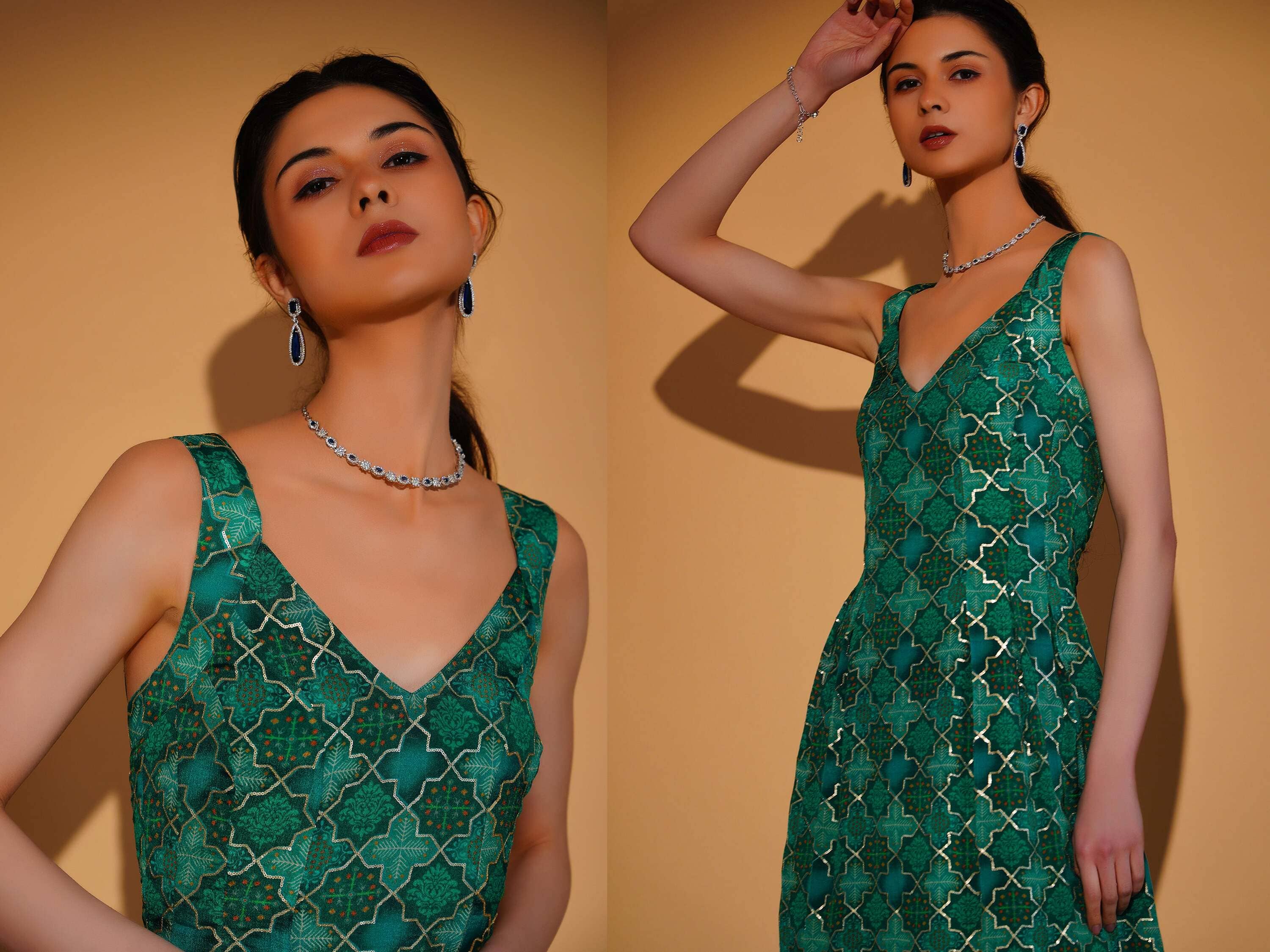 Woman wearing a green patterned dress against a yellow background