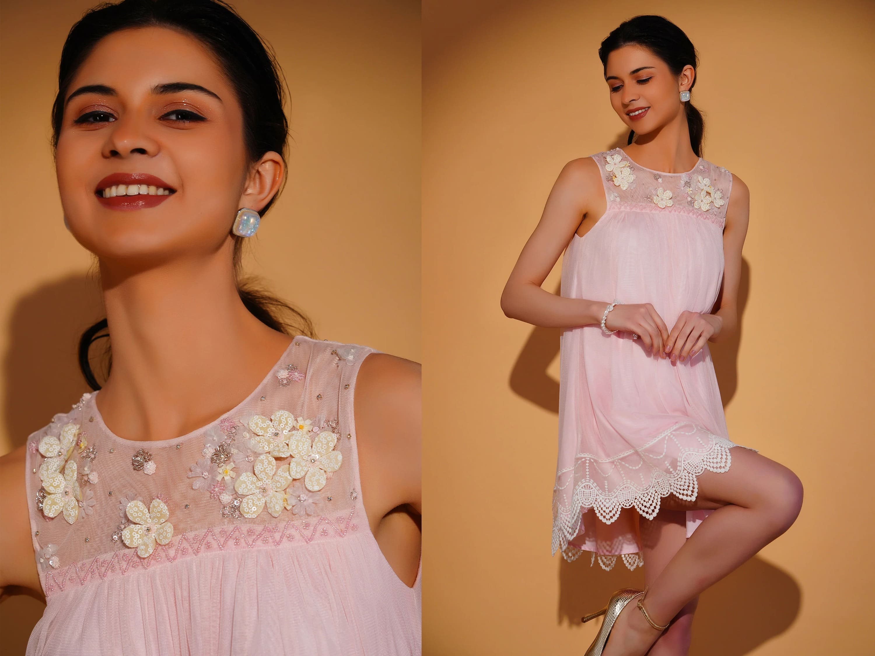 Woman wearing a pink dress with floral embellishments against a beige background