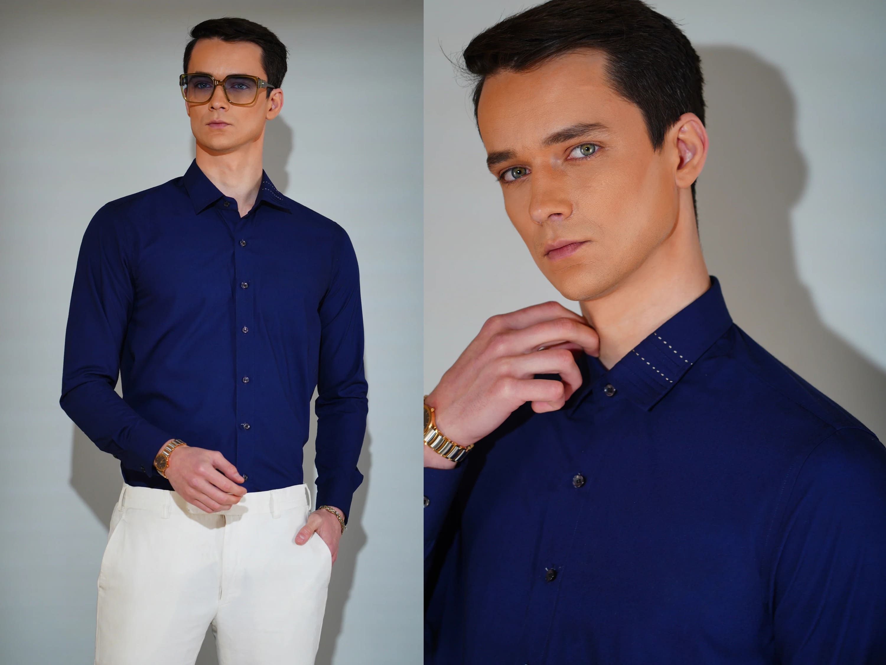 Man wearing a blue shirt and white pants on a plain background